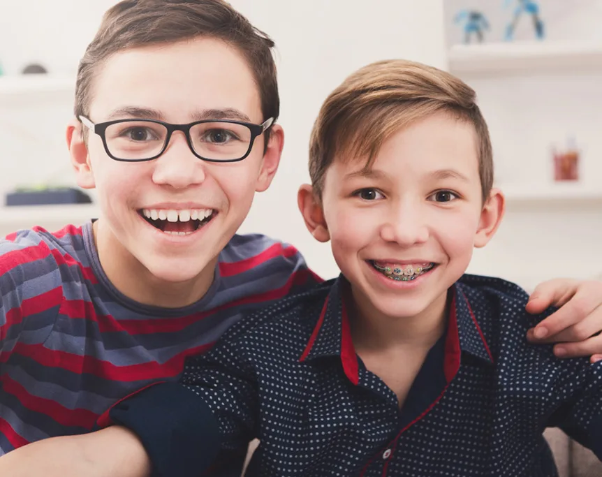Two happy young patients smiling